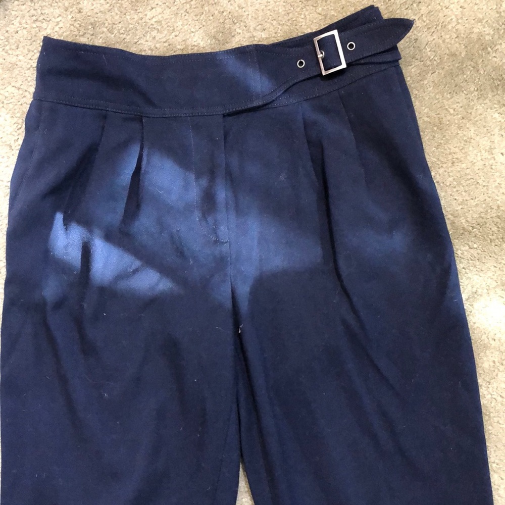 Anthropologie high waisted dark blue pants.